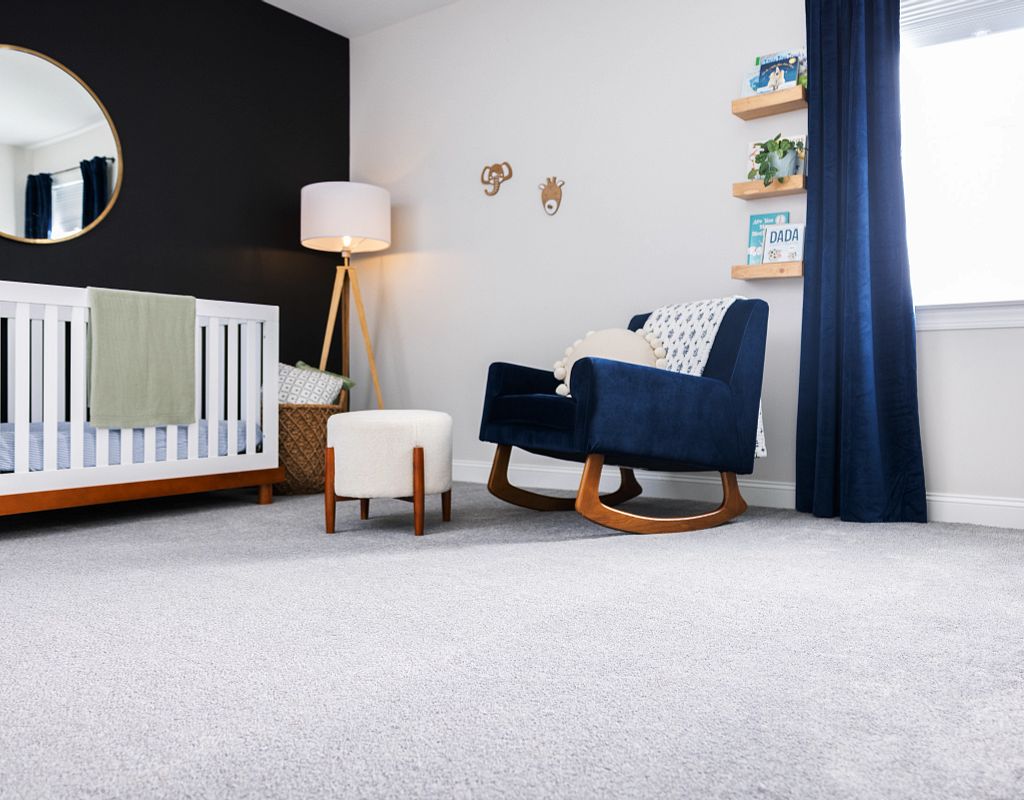 Blue chair on carpet floor | Cherry City Interiors
