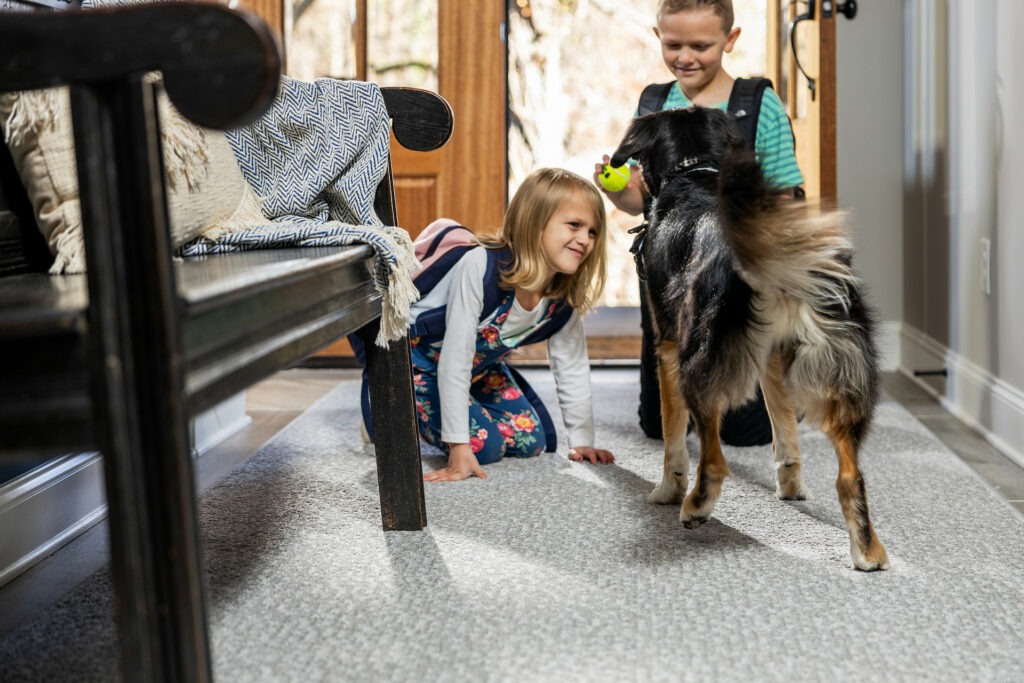 Kids playing with dog | Cherry City Interiors