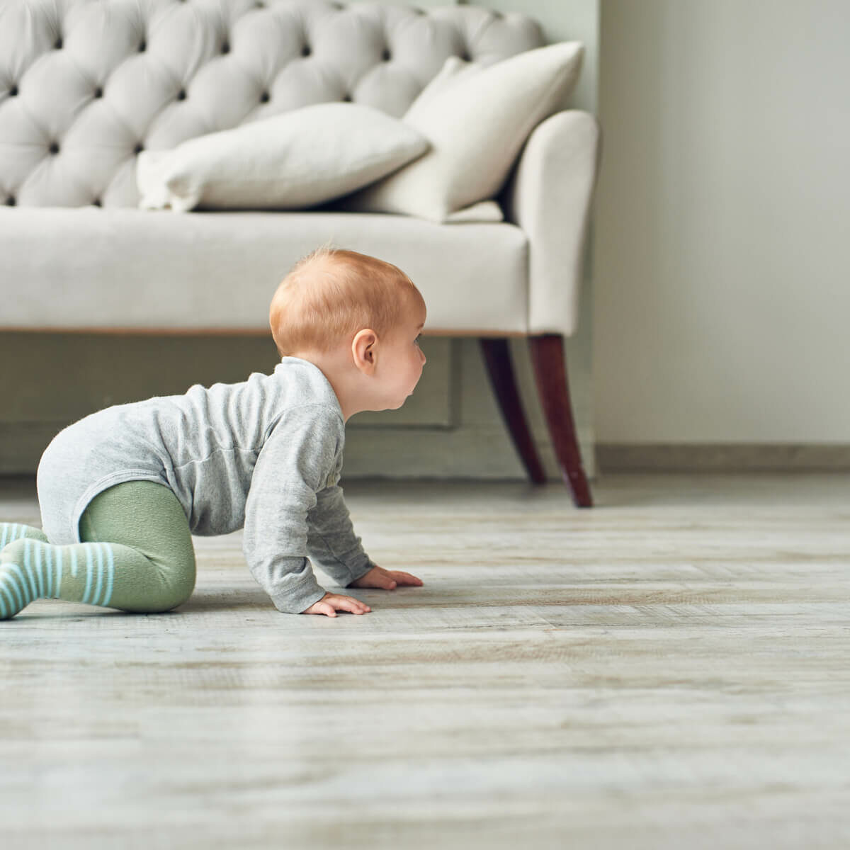 baby on luxury vinyl floor | Cherry City Interiors