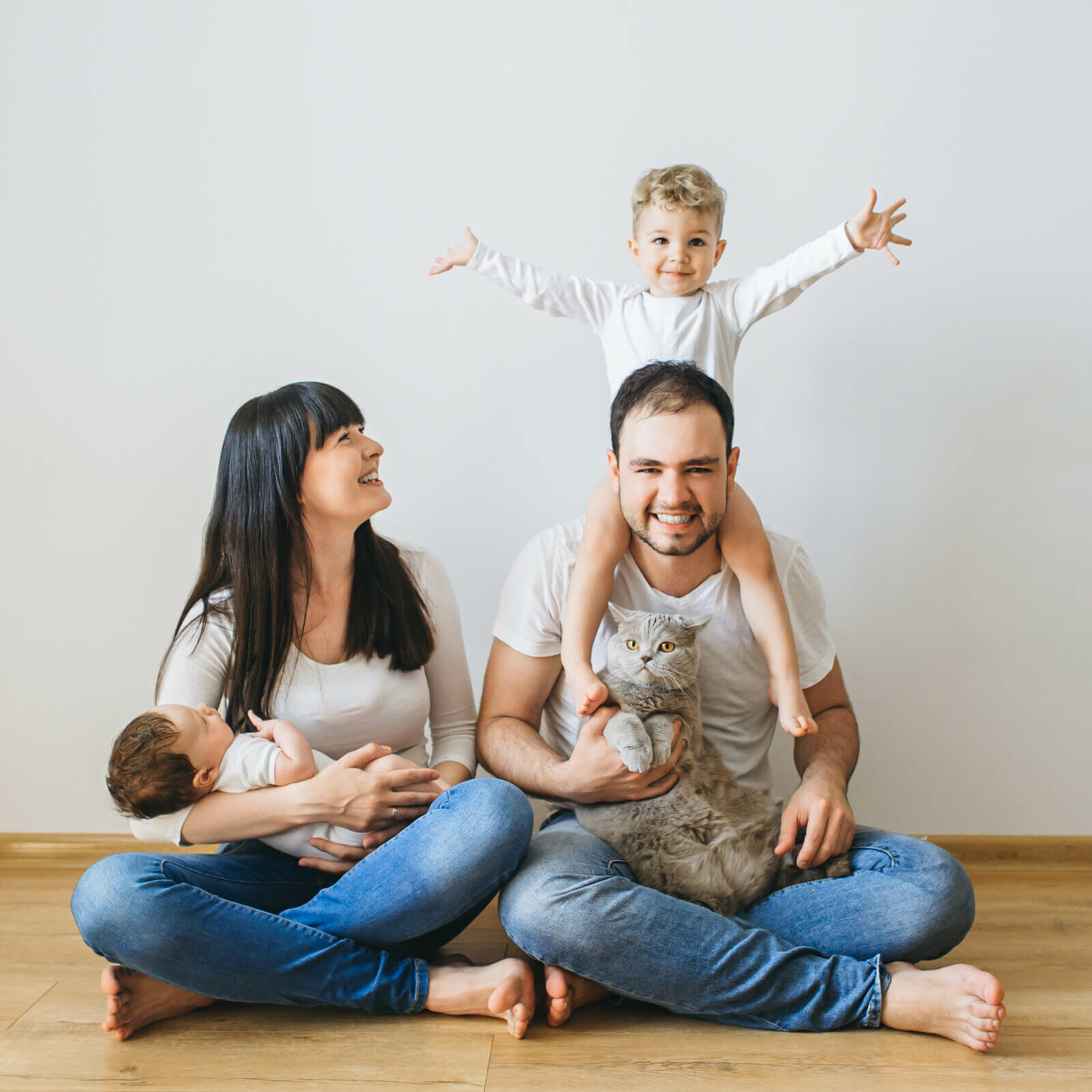 Family on Hardwood floor | Cherry City Interiors